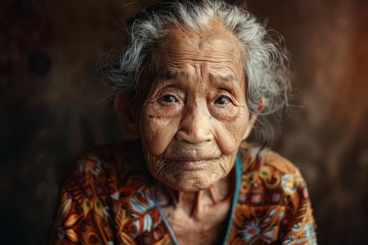 Senior asian woman posing with traditional clothing photo