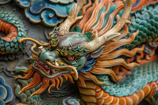 Colorful chinese dragon head statue showing sharp teeth photo