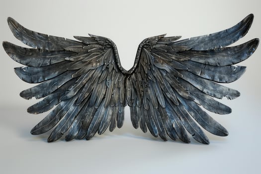 Large detailed metallic bird wings standing up on white background photo