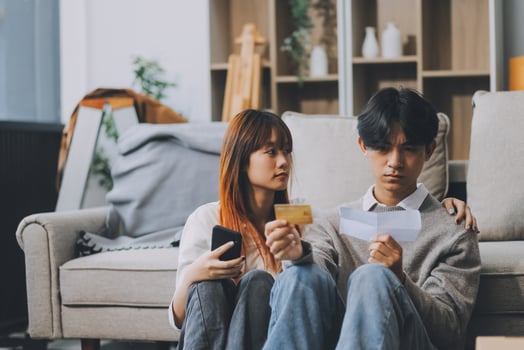 Worried annoyed young husband wife using phone credit card dissatisfied with interrupted wifi internet connection slow bad app work. Angry family couple bank clients unable to pay online check balance photo