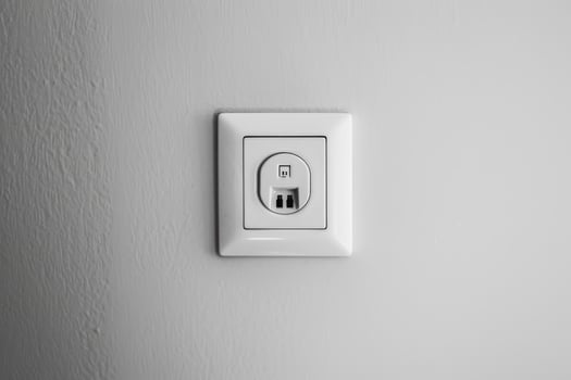 Modern white electrical wall outlet photo