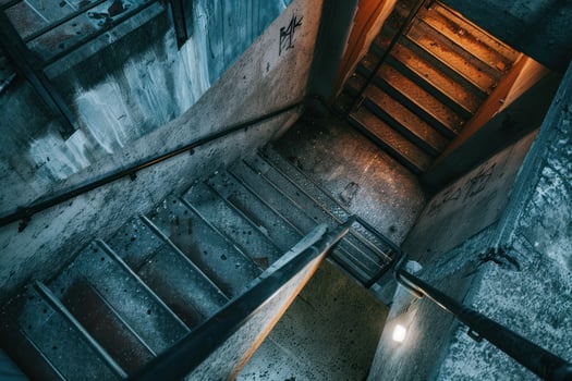 Mysterious stairway in dimly lit urban building photo