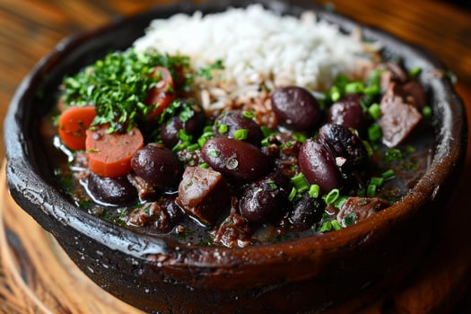 Brazilian feijoada with rice in traditional clay pot photo