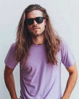 A stylish model poses confidently in a plain t-shirt with long hair photo