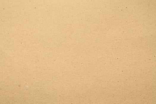 A brown paper background with a few holes photo