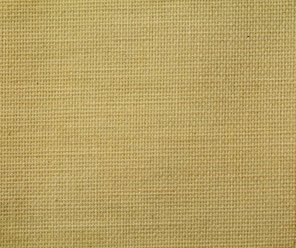 Natural Linen Material Textile Canvas Fabric Texture Background Close-up Detail of Fabric Natural Color Hemp Material Pattern Design Wallpaper. Can be Used as Background or For Graphic Design photo