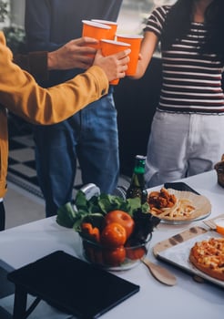 Group of young friends eating pizza.Home party. photo