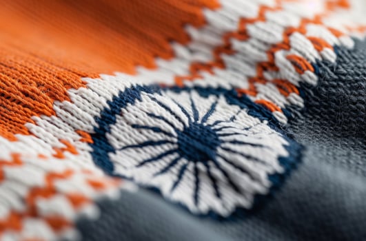 Vibrant Fabric With Orange and Gray Stripes on a Soft Surface photo