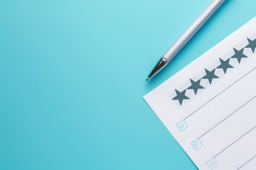 A sleek feedback form lays on a solid background, accompanied by a shiny pen, inviting users to share their thoughts thoughtfully. photo