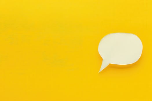 A customer support chat window appears on a vibrant yellow background, inviting interaction and assistance. photo