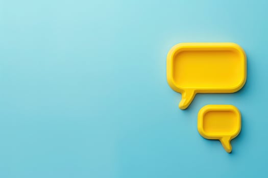 Two bright yellow chat bubbles rest against a tranquil blue backdrop, symbolizing lively customer interaction and support. photo