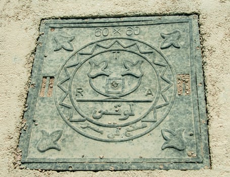 EGYPT, MARSA ALAM- FEBRUARY 24, 2019 cast metal manhole cover with Egyptian inscriptions, Egypt photo
