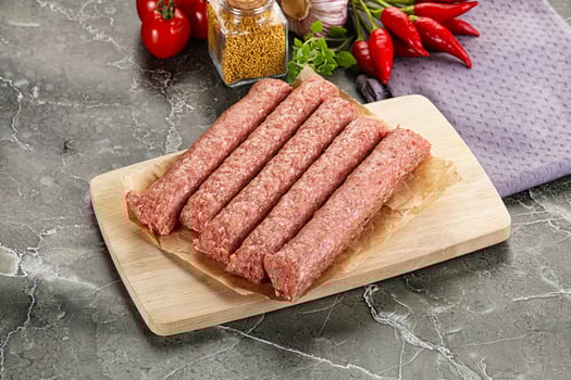 Raw beef kebab sausage for grill photo