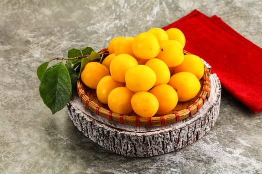 Ripe sweet juicy yellow plum photo