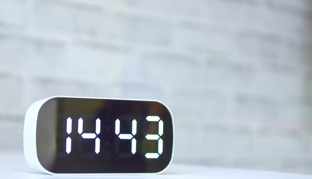 White digital clock on the table photo