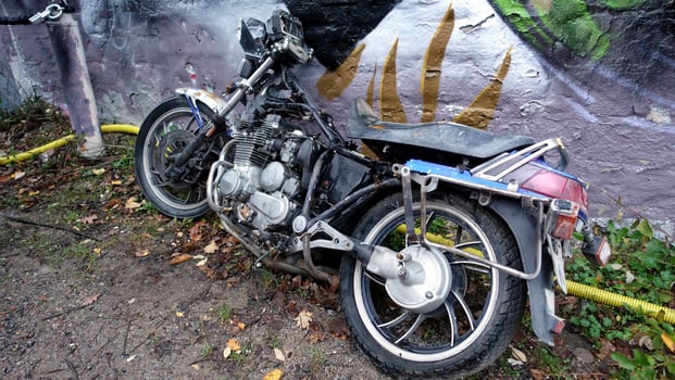 Stockholm, Snosatra, October 28, 2020. An old abandoned motorcycle leaning against a wall photo