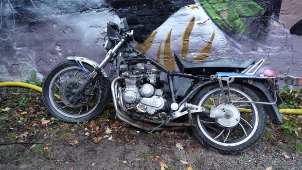 Stockholm, Snosatra, October 28, 2020. An old abandoned motorcycle leaning against a wall photo