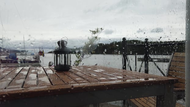 the rain on the terrace overlooking the marina photo