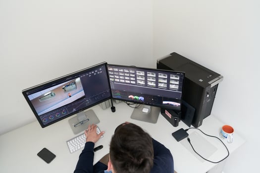 professional editor enhancing digital footage using specialized software photo