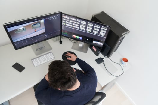 professional editor enhancing digital footage using specialized software photo
