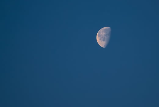 Bright moon against the dark night sky photo