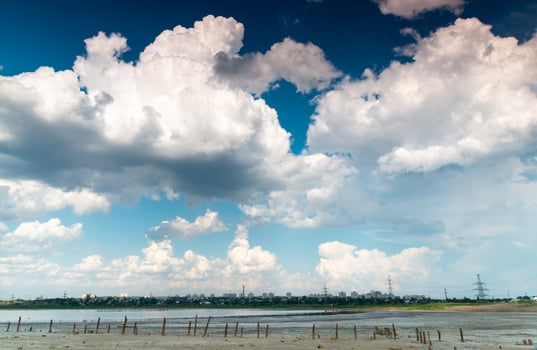 Fluffy white rain clouds over the horizon, south of Ukraine photo