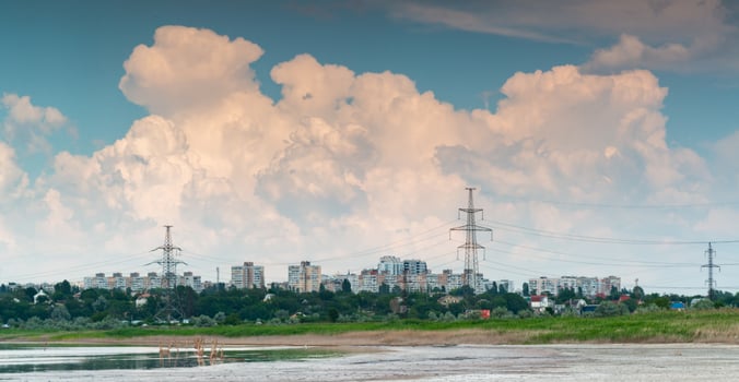 Fluffy white rain clouds over the city near Kuyalnik estuary, south of Ukraine photo