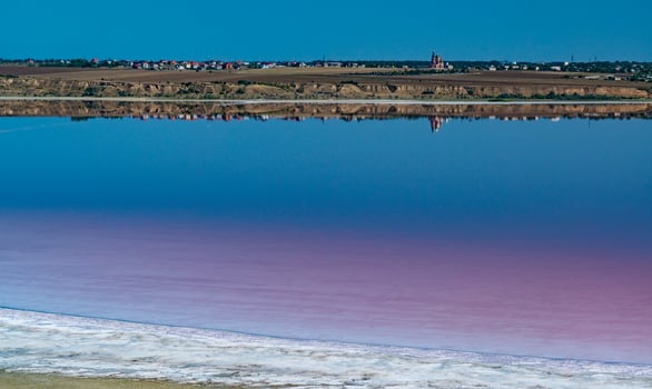 Salty Kuyalnik estuary with flowering water, Artemia salina and Dunaliella salina in the water. Self-settling salt sodium chloride photo