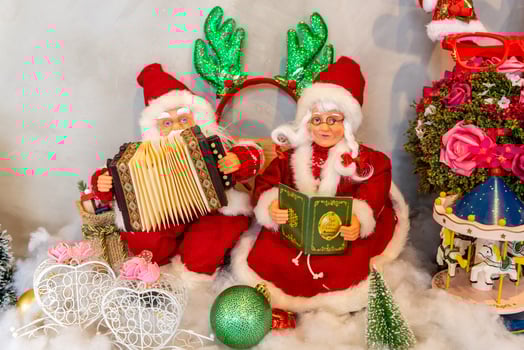 santa claus doll, santa claus statue with christmas decorations and gifts. christmas decorations for new year celebration photo
