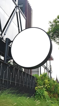 Round mock up sign on white building wall, amazing for your business logo photo