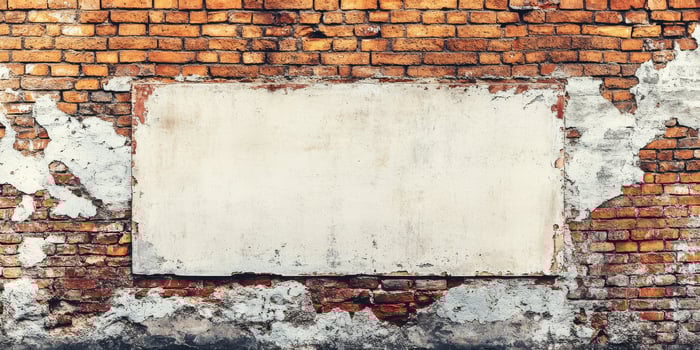 A weathered brick wall that has an expansive blank white space, making it an ideal canvas for various promotional content, advertisements, or artistic displays and creative expressions photo