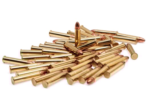 Small-caliber rifle cartridges isolated on white photo