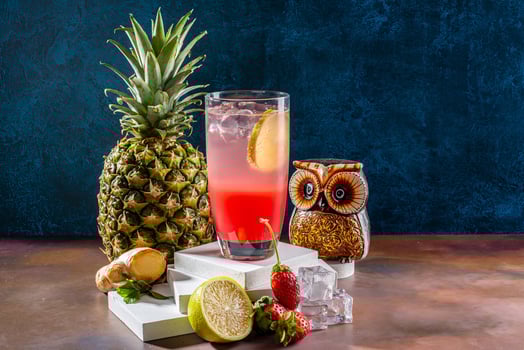 Refreshing Fruit Cocktail with Shaker and Ice Cubes photo