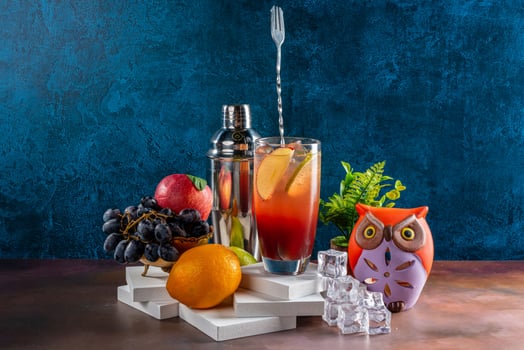 Cocktail of orange with Shaker and Ice Cubes photo