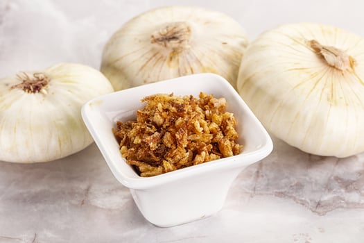 Dried roasted onion flakes for culinary photo