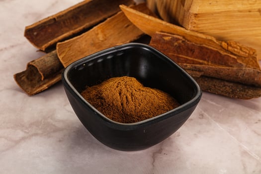 Natural Cinnamon powder with sticks photo