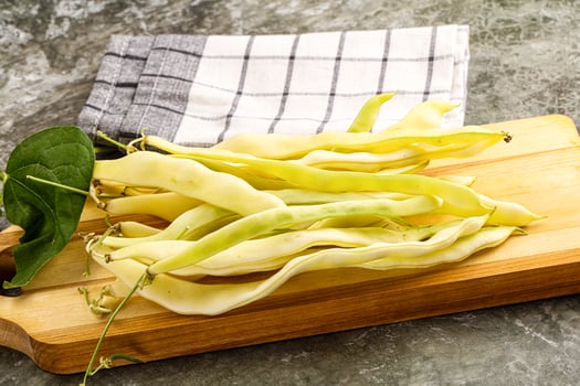 Raw green bean strings heap photo