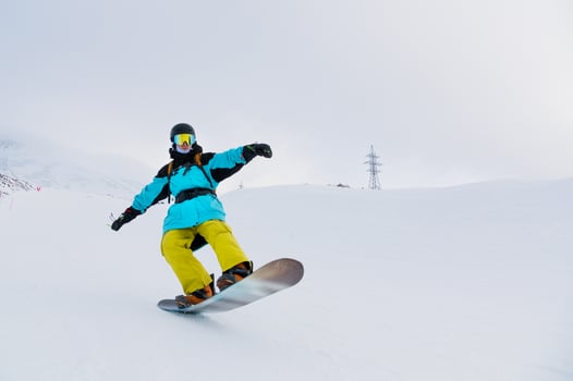 Snowboarder rides on powder snow. Freeride at a ski resort photo