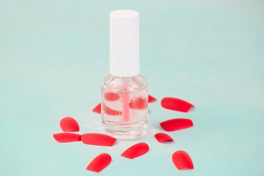 manicure flat on a turquoise background. glitters for manicure or makeup design, false nails photo