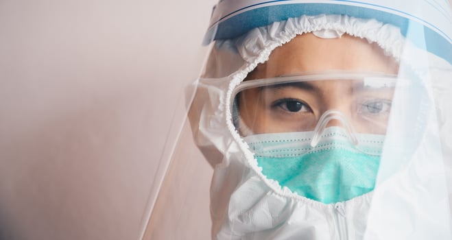Cropped shot of confidence healthcare worker while wearing PPE suit before working in hospital during Covid-19 pandemic. photo