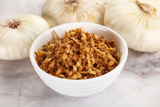 Dried roasted onion flakes for culinary photo