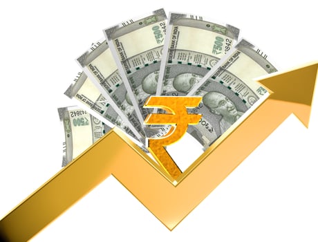 Group of Gold coins and rupees tower on white.Indian rupees and coin. photo