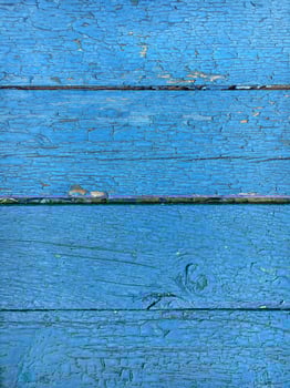 Background from blue boards with cracked paint. Vintage background in blue color photo