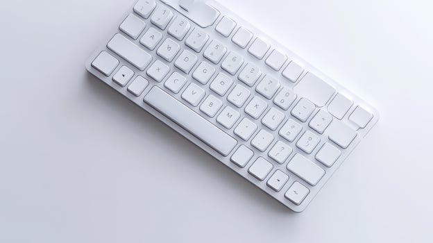 Minimalistic white keyboard on a light surface photo