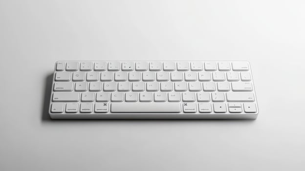 White wireless keyboard on a light surface, showcasing a modern design and compact layout photo