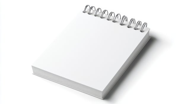 Blank spiral notebook placed on a clean surface, ready for notes or sketches during early morning hours photo