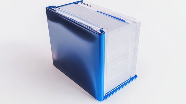 Blue binder filled with documents standing upright on a white background photo