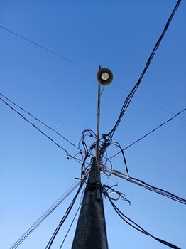 small electric poles in the village for street lighting photo