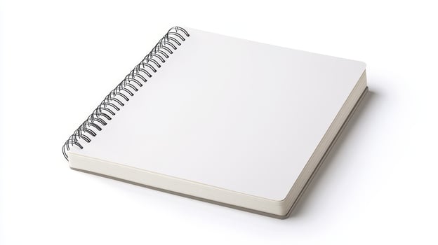 Blank spiral notebook on a white background for creative writing, drawing, or sketching activities photo