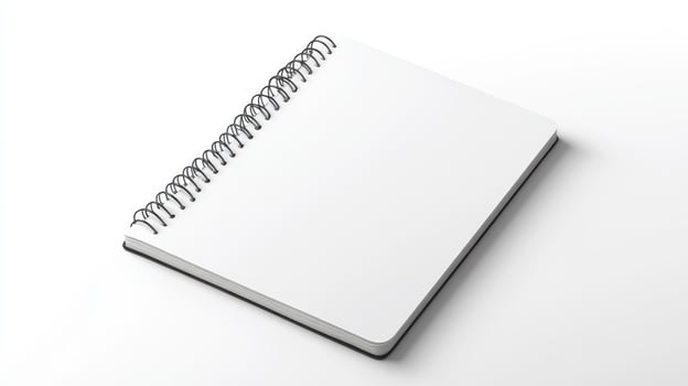 A blank spiral notebook resting on a clean surface ready for notes and sketches photo